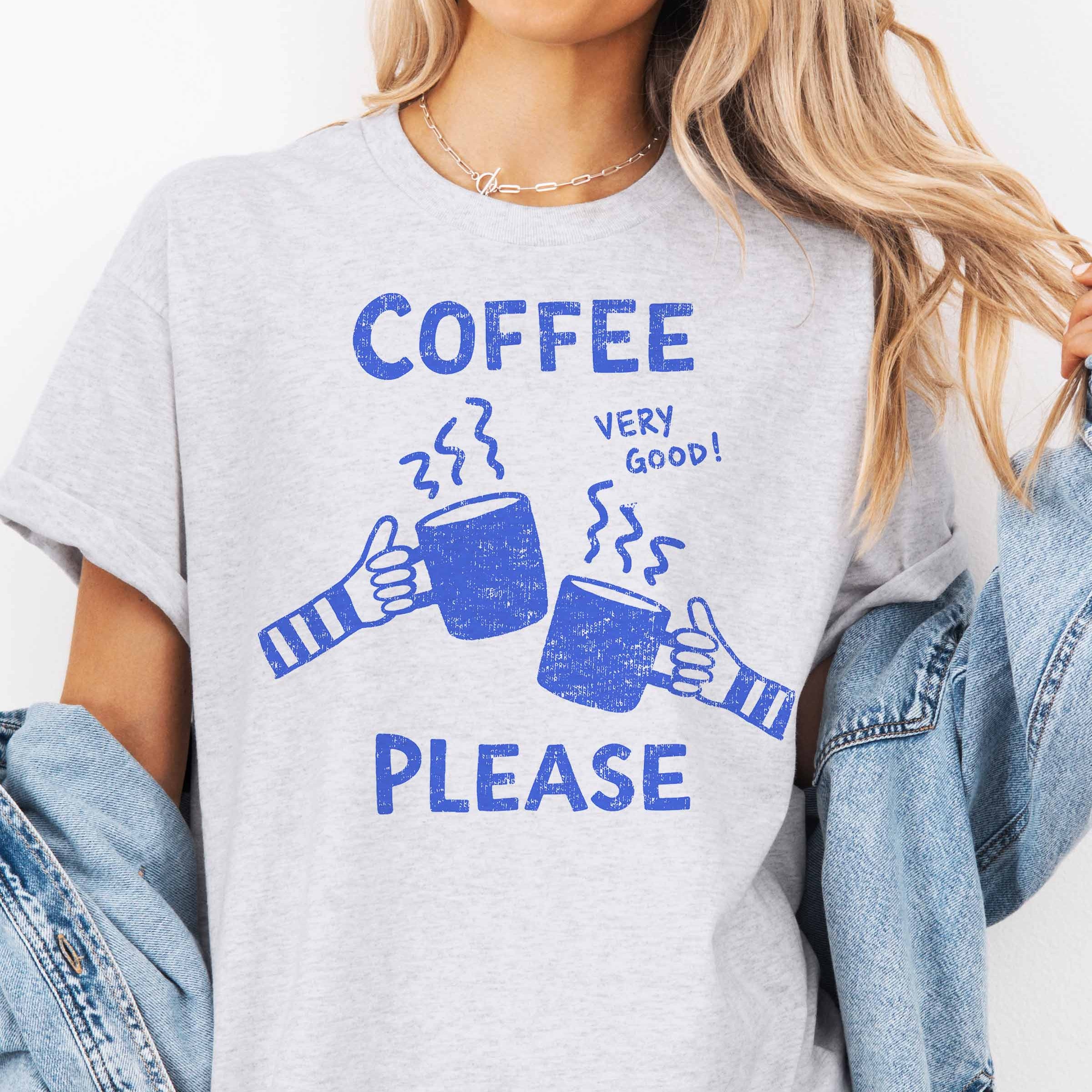 Oversized grafik t-shirt mit Kaffee Bitte Grafik in blauer Schrift auf grauem Hintergrund.